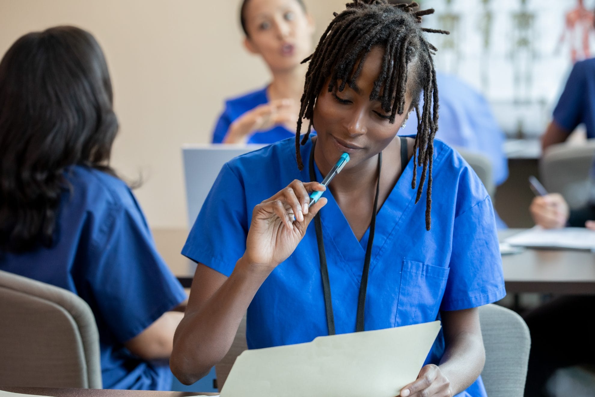Caregiver deep in thought while taking test.