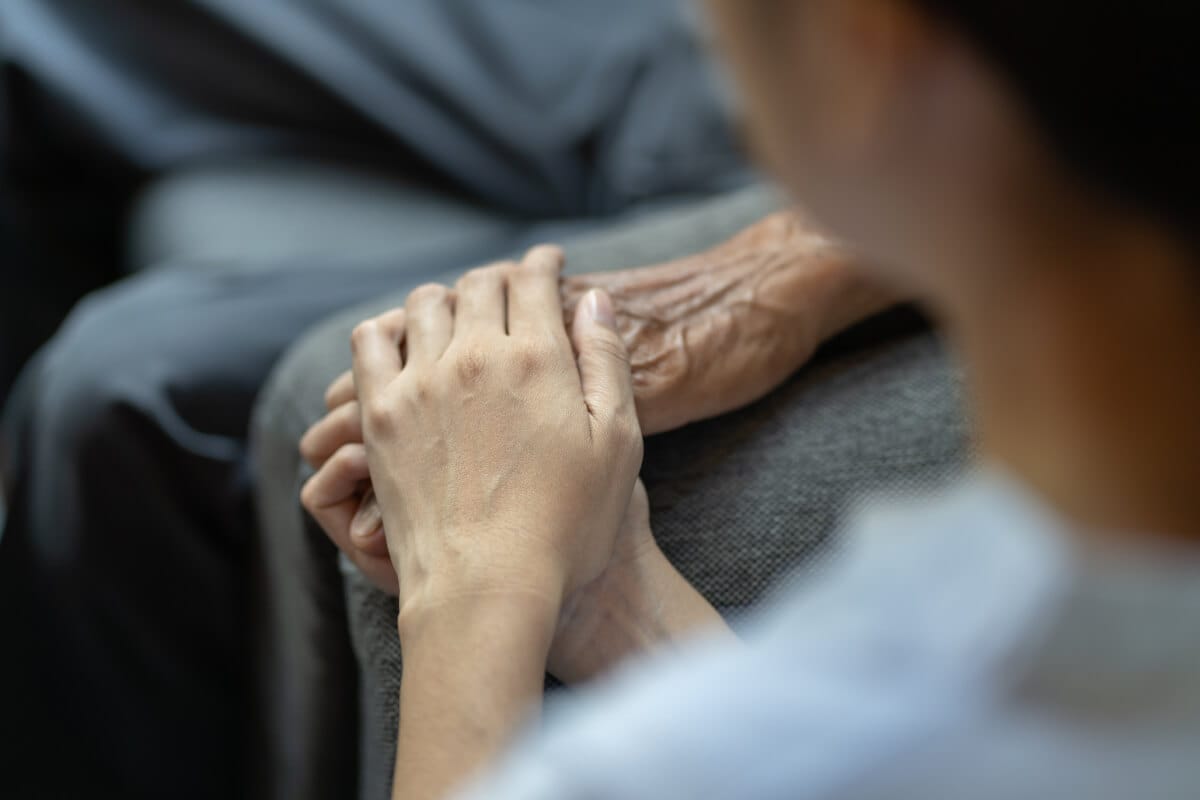 Holding-hands-caregiving-moment