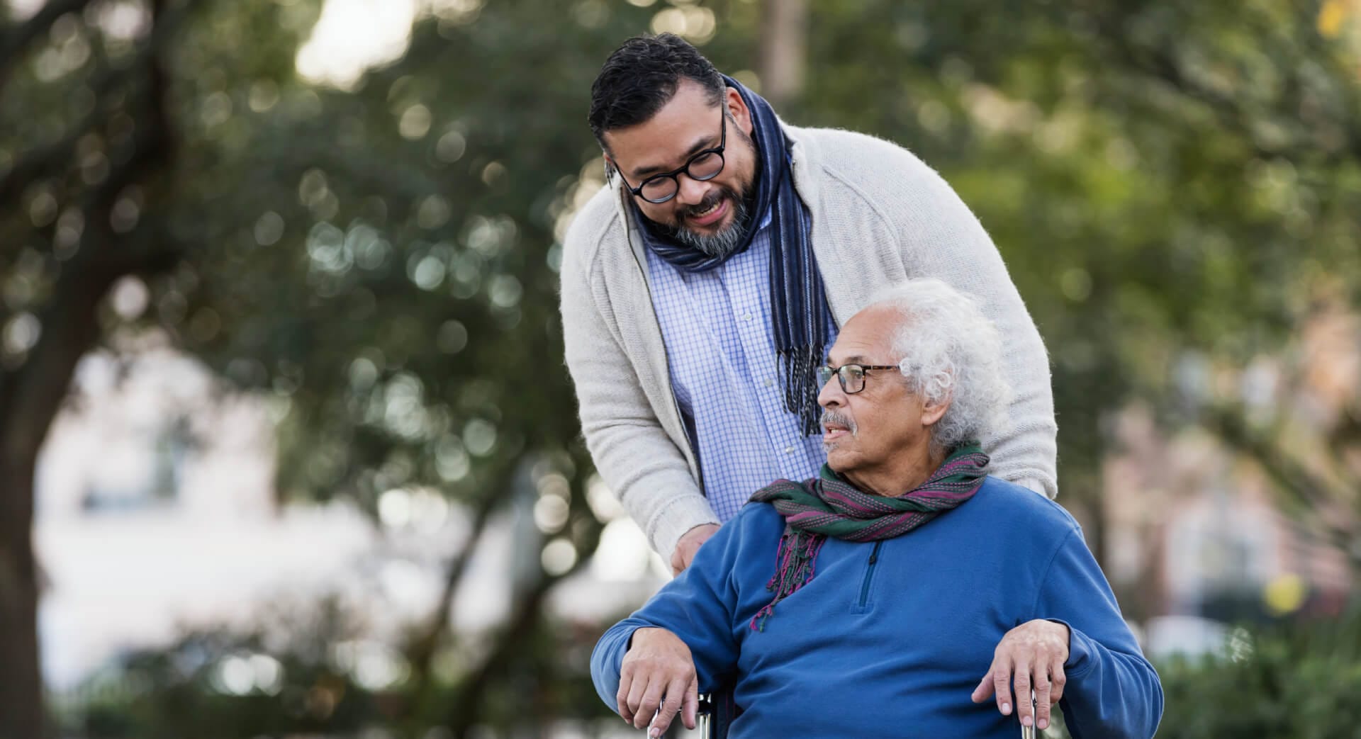 Senior man in wheelchair with family