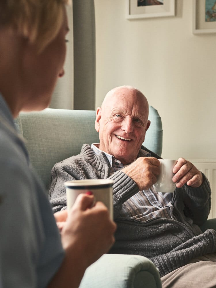 Senior talking to caregiver