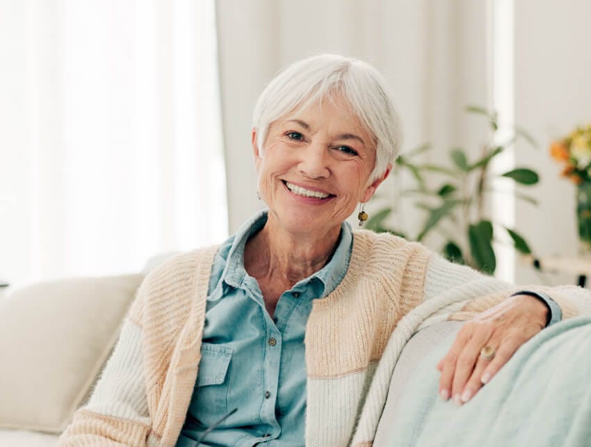 Happy senior woman relaxing at home